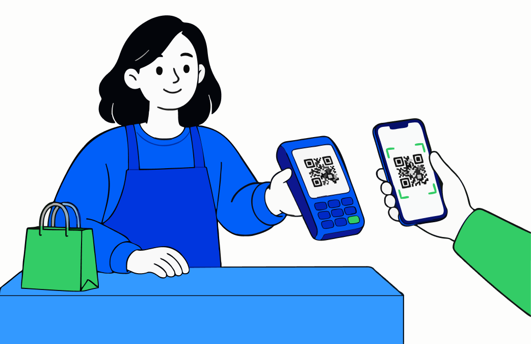 A shop assistant behind the counter holds up a payment terminal showing a QR code; a customer scans it with their phone to pay.